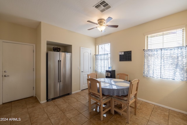 tiled dining area featuring a wealth of natural light and ceiling fan