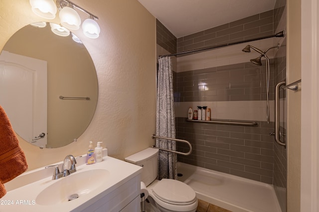 bathroom featuring vanity, toilet, and walk in shower