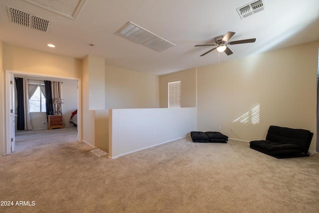 interior space with ceiling fan