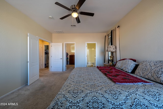 bedroom featuring carpet, ceiling fan, and ensuite bath