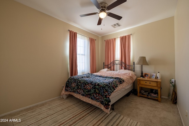 carpeted bedroom featuring ceiling fan