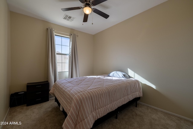 bedroom with ceiling fan and carpet floors