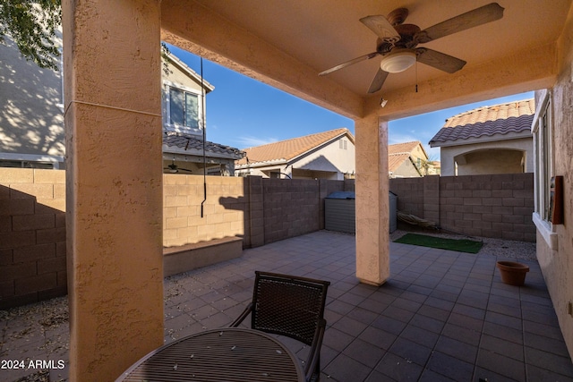 view of patio featuring ceiling fan