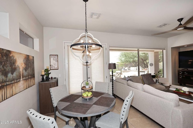 6937 E Purple Shade Cir, Scottsdale, AZ 85266 - dining room with a chandelier, ceiling fan, and light tile patterned floors