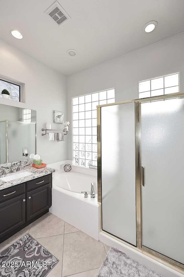 6937 E Purple Shade Cir, Scottsdale, AZ 85266 - full bath featuring vanity, a garden tub, a shower stall, and recessed lighting