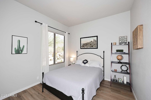 6937 E Purple Shade Cir, Scottsdale, AZ 85266 - bedroom featuring wood finished floors and baseboards