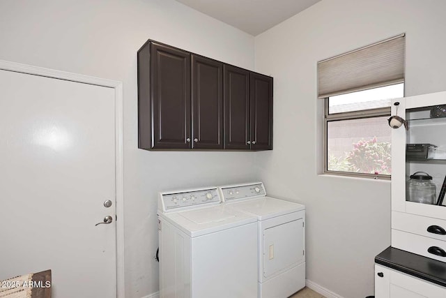 6937 E Purple Shade Cir, Scottsdale, AZ 85266 - laundry room featuring washing machine and dryer, cabinet space, and baseboards