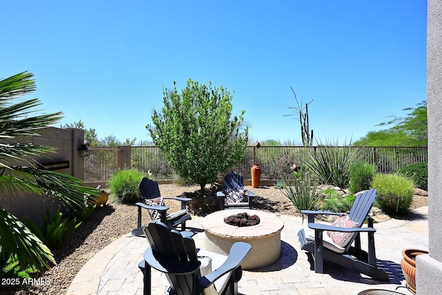 6937 E Purple Shade Cir, Scottsdale, AZ 85266 - fenced backyard with an outdoor fire pit and a patio