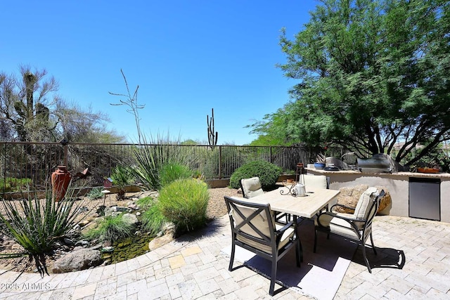 6937 E Purple Shade Cir, Scottsdale, AZ 85266 - fenced backyard featuring an outdoor kitchen, a patio area, and outdoor dining space