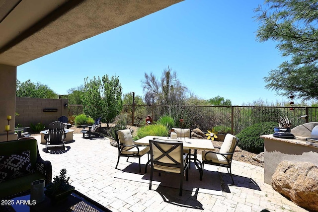 6937 E Purple Shade Cir, Scottsdale, AZ 85266 - fenced backyard with outdoor dining area, a patio, and exterior kitchen