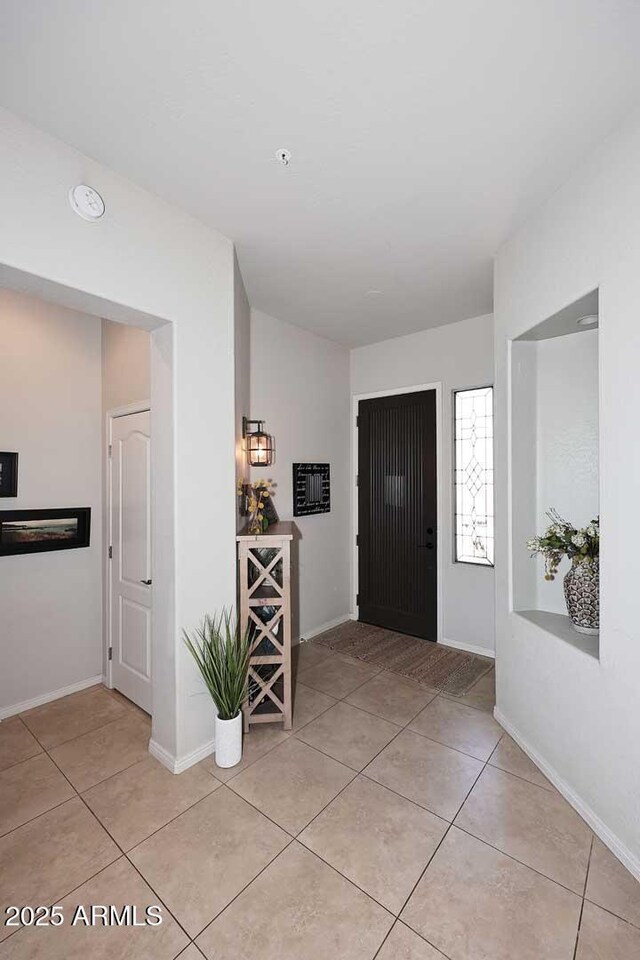 6937 E Purple Shade Cir, Scottsdale, AZ 85266 - entryway featuring light tile patterned floors and baseboards