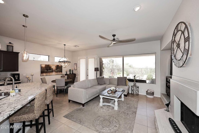 6937 E Purple Shade Cir, Scottsdale, AZ 85266 - living room featuring light tile patterned floors, plenty of natural light, and a ceiling fan