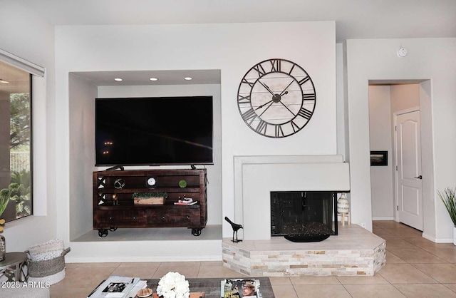 6937 E Purple Shade Cir, Scottsdale, AZ 85266 - tiled living area featuring a fireplace with raised hearth
