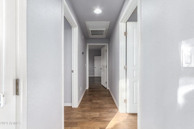 hall with hardwood / wood-style flooring