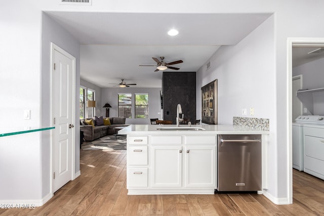 kitchen featuring light hardwood / wood-style flooring, ceiling fan, dishwasher, and sink