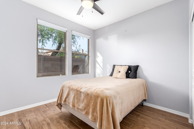 bedroom featuring ceiling fan and wood-type flooring