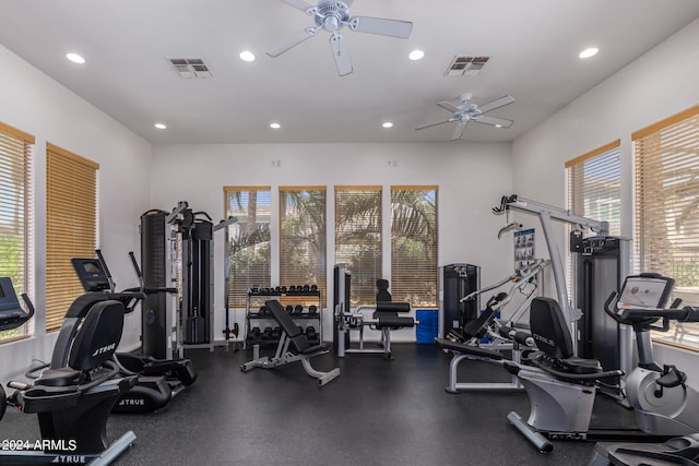 gym featuring a healthy amount of sunlight and ceiling fan