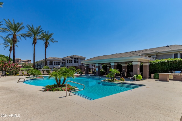 view of pool featuring a patio area