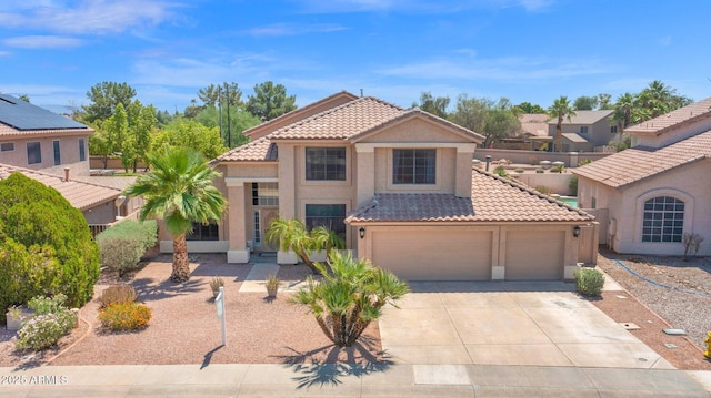 981 N Quail Ln, Gilbert, AZ 85233 - view of front of house with a tiled roof, stucco siding, concrete driveway, and an attached garage