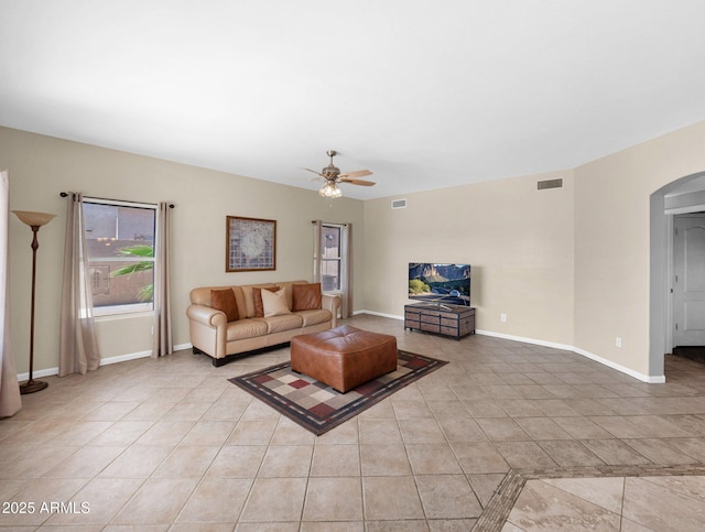 981 N Quail Ln, Gilbert, AZ 85233 - living area featuring arched walkways, ceiling fan, and light tile patterned floors