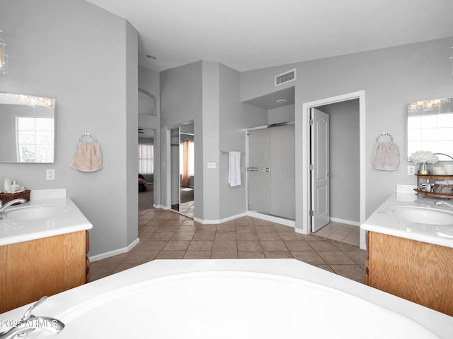 981 N Quail Ln, Gilbert, AZ 85233 - full bathroom featuring double vanity, tile patterned floors, a tub, ensuite bath, and a shower