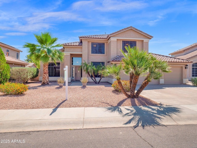 981 N Quail Ln, Gilbert, AZ 85233 - mediterranean / spanish house featuring stucco siding, a tiled roof, driveway, and a garage