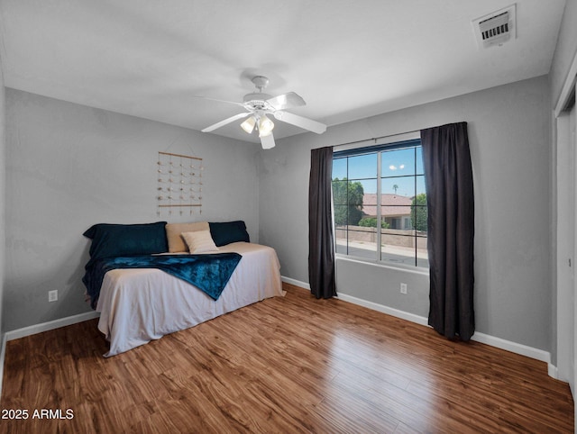 981 N Quail Ln, Gilbert, AZ 85233 - bedroom featuring wood finished floors and a ceiling fan