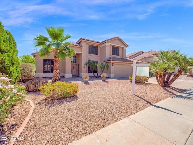 981 N Quail Ln, Gilbert, AZ 85233 - mediterranean / spanish-style house featuring stucco siding, concrete driveway, an attached garage, and a tiled roof