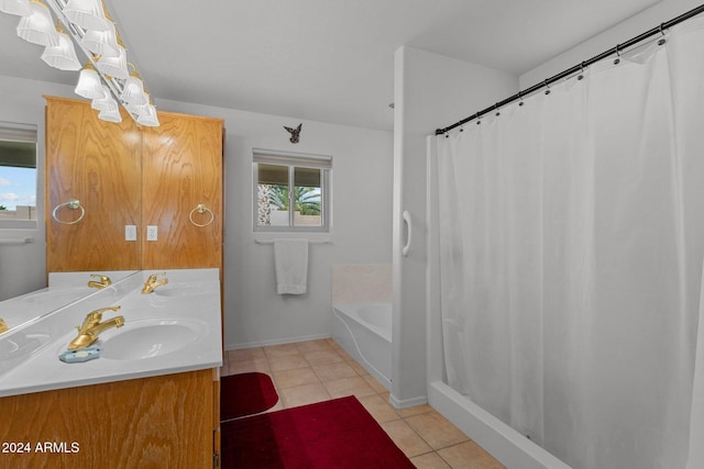 bathroom featuring tile patterned flooring, vanity, and a bathtub