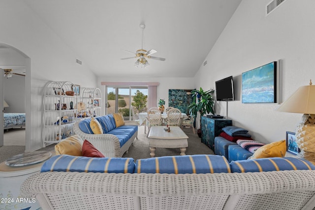 living room featuring carpet, vaulted ceiling, and ceiling fan