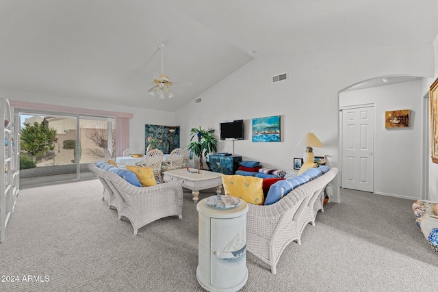 living room with ceiling fan, light carpet, and high vaulted ceiling