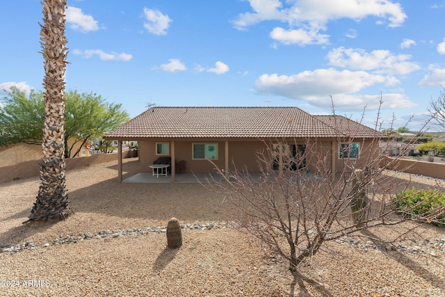 rear view of house with a patio