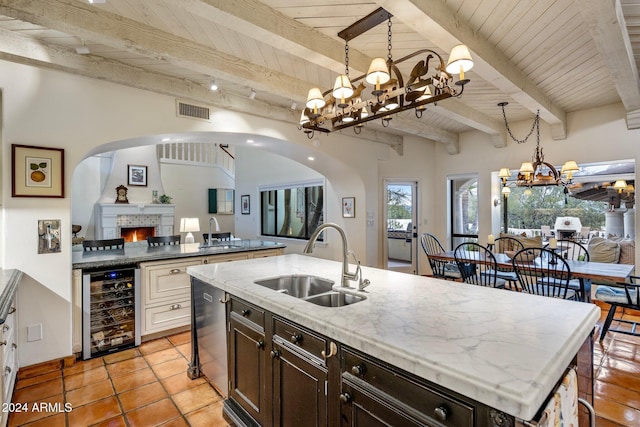 kitchen with beam ceiling, wine cooler, and wood ceiling