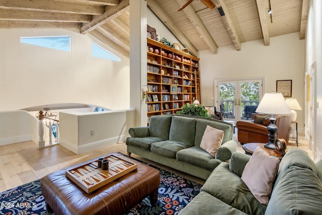 living room featuring vaulted ceiling with beams, light wood-type flooring, wood ceiling, and french doors