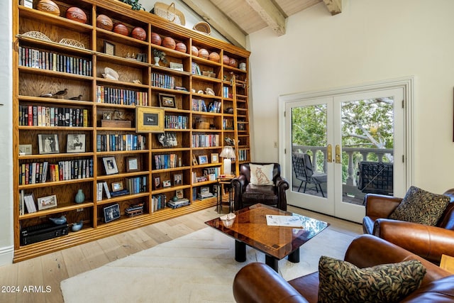 sitting room with lofted ceiling with beams, wooden ceiling, french doors, and light hardwood / wood-style flooring