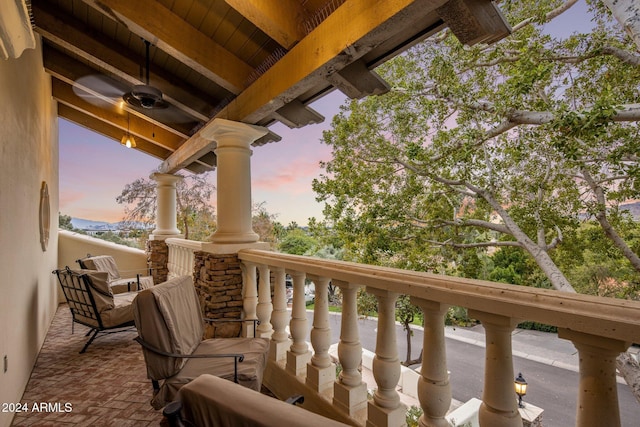 view of balcony at dusk