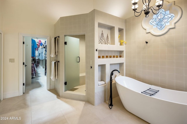 bathroom with tile patterned floors, separate shower and tub, tile walls, and a notable chandelier