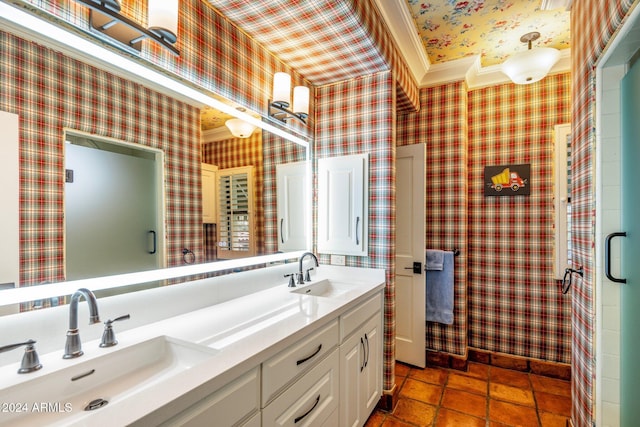 bathroom with crown molding and vanity