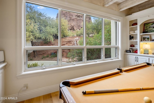 playroom featuring beamed ceiling, hardwood / wood-style flooring, and pool table