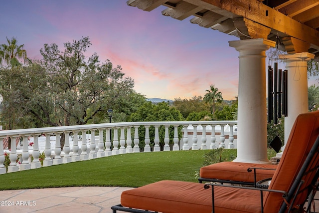 view of balcony at dusk