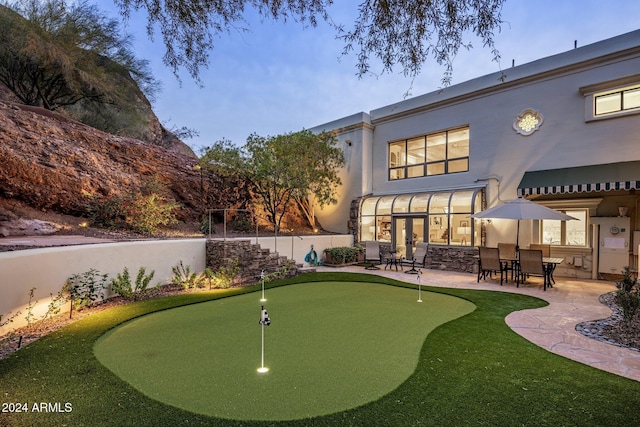 exterior space featuring a patio and a sunroom