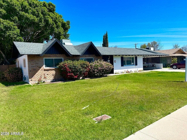 single story home with a front yard