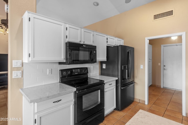 5552 S Feather Bush Ct, Gold Canyon, AZ 85118 - kitchen with light tile patterned floors, white cabinetry, visible vents, black appliances, and backsplash