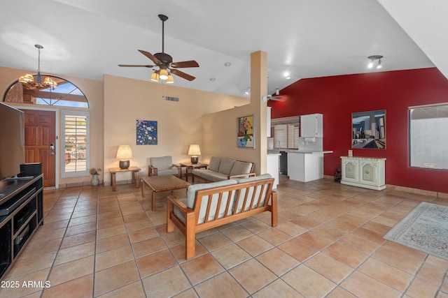 5552 S Feather Bush Ct, Gold Canyon, AZ 85118 - living area with light tile patterned floors, visible vents, ceiling fan with notable chandelier, and lofted ceiling