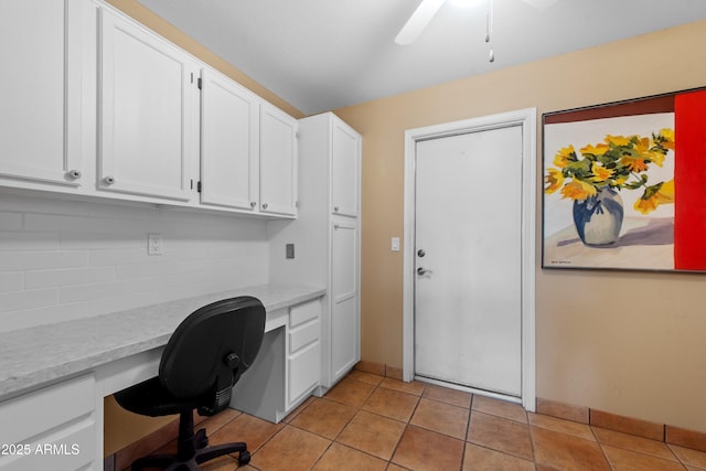 5552 S Feather Bush Ct, Gold Canyon, AZ 85118 - home office featuring light tile patterned flooring, built in study area, a ceiling fan, and baseboards