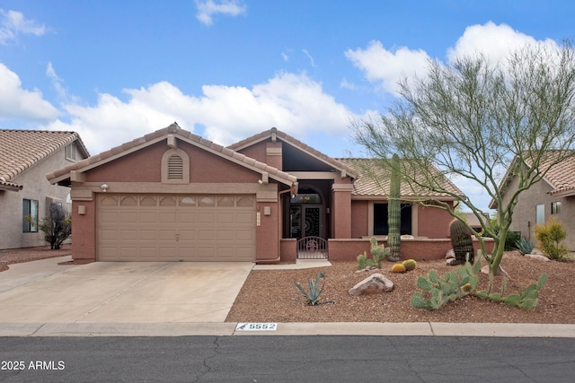 5552 S Feather Bush Ct, Gold Canyon, AZ 85118 - ranch-style house featuring a garage, driveway, a tiled roof, and stucco siding