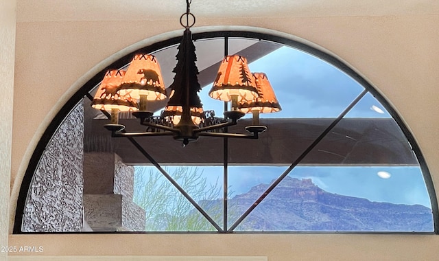 5552 S Feather Bush Ct, Gold Canyon, AZ 85118 - details with a chandelier and stucco siding