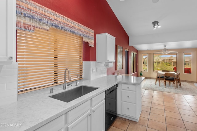5552 S Feather Bush Ct, Gold Canyon, AZ 85118 - kitchen with ceiling fan, light tile patterned floors, black dishwasher, a sink, and lofted ceiling