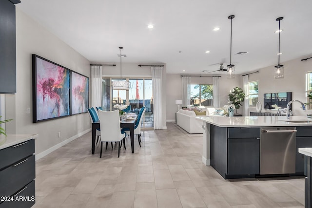 kitchen with decorative light fixtures, light tile patterned floors, sink, stainless steel dishwasher, and ceiling fan