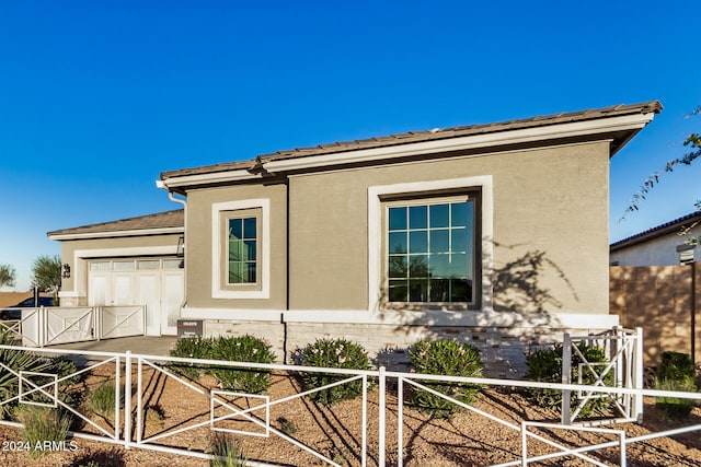 view of home's exterior with a garage